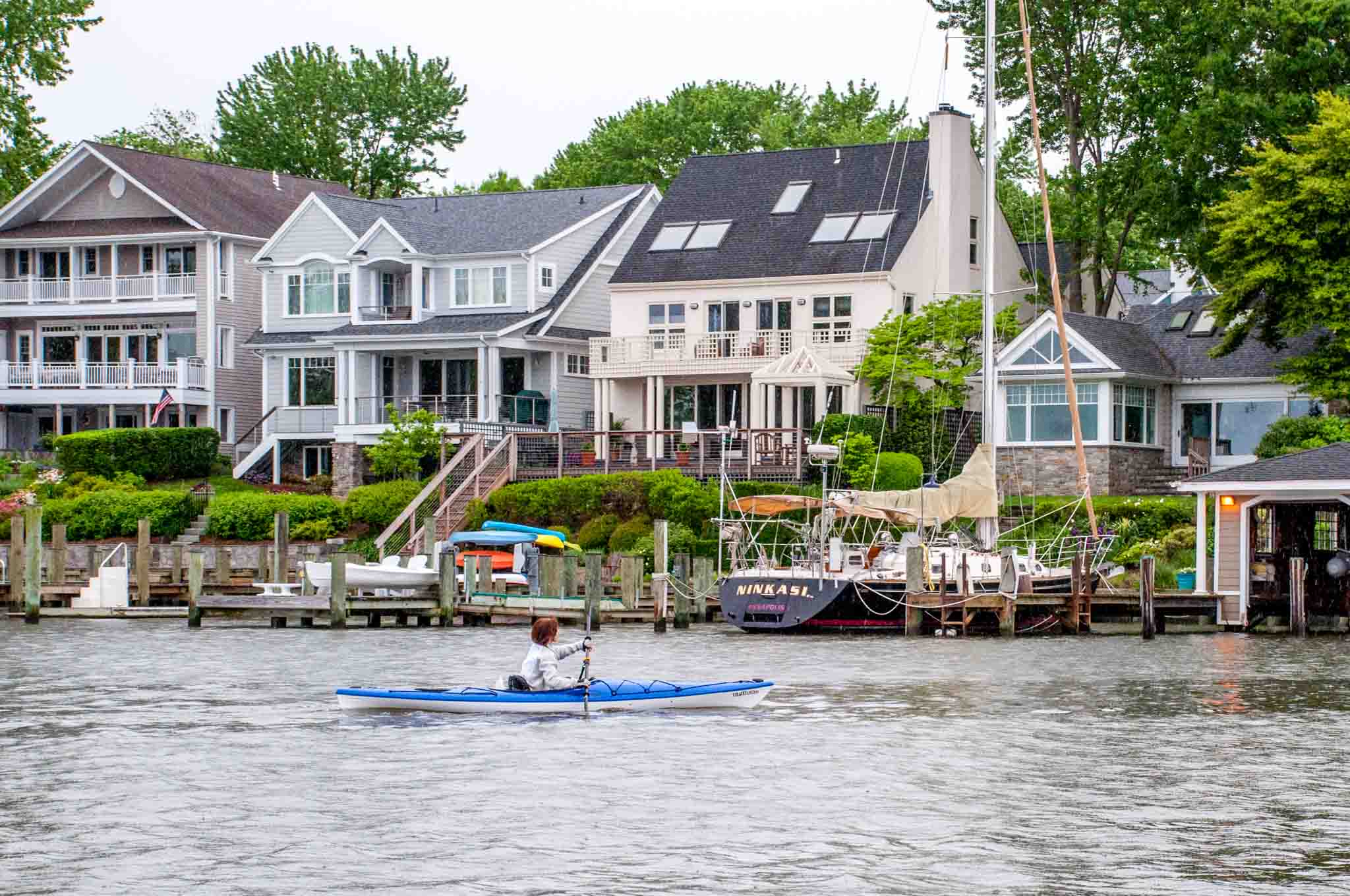 Woman kayaking in Spa Creek.