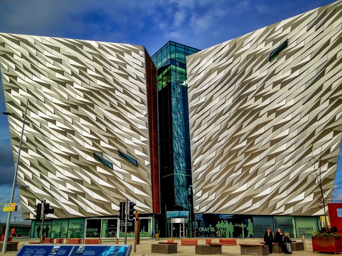 Exterior of a large building with silver-colored and glass walls