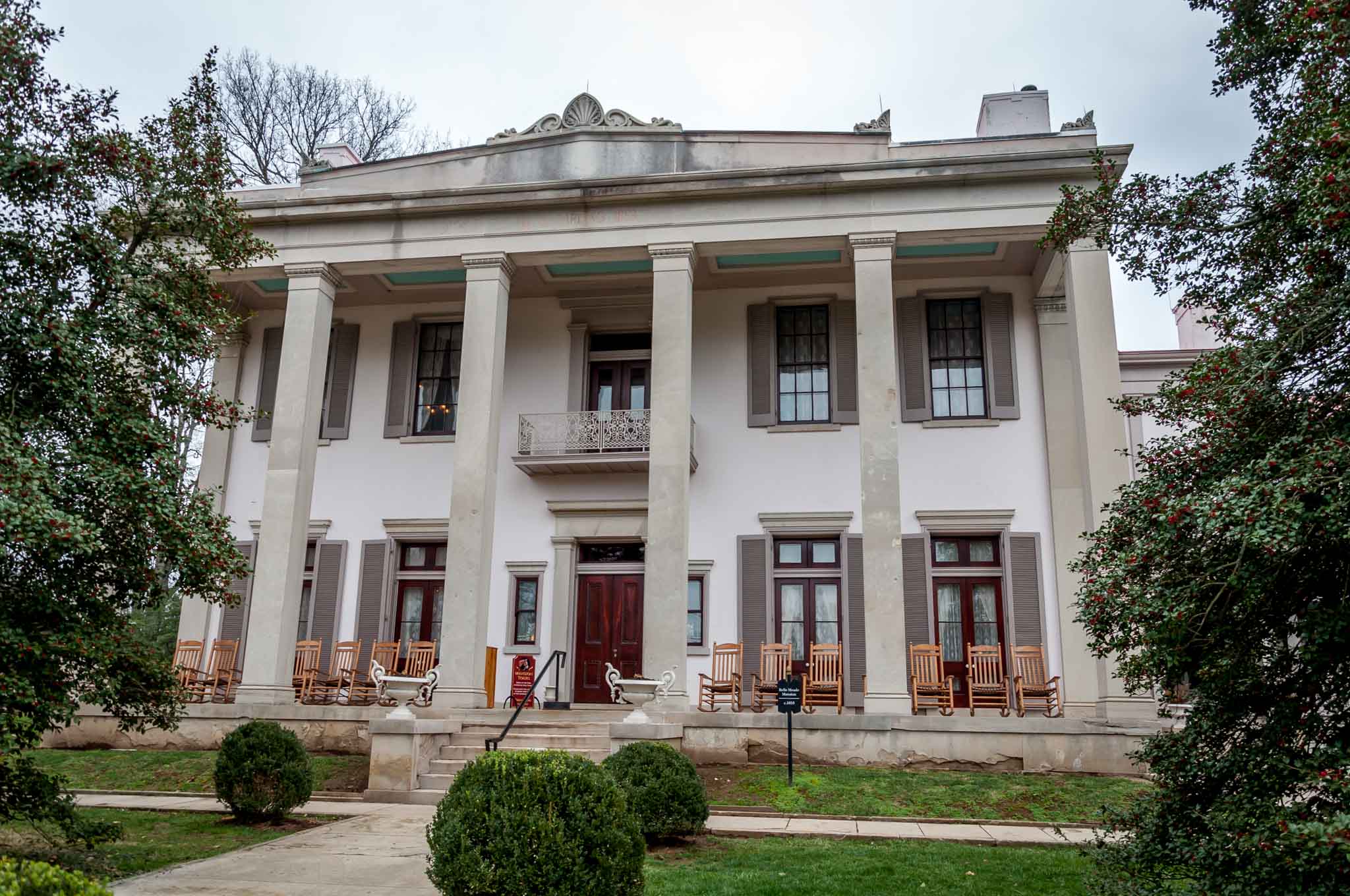 Large white house with columns.