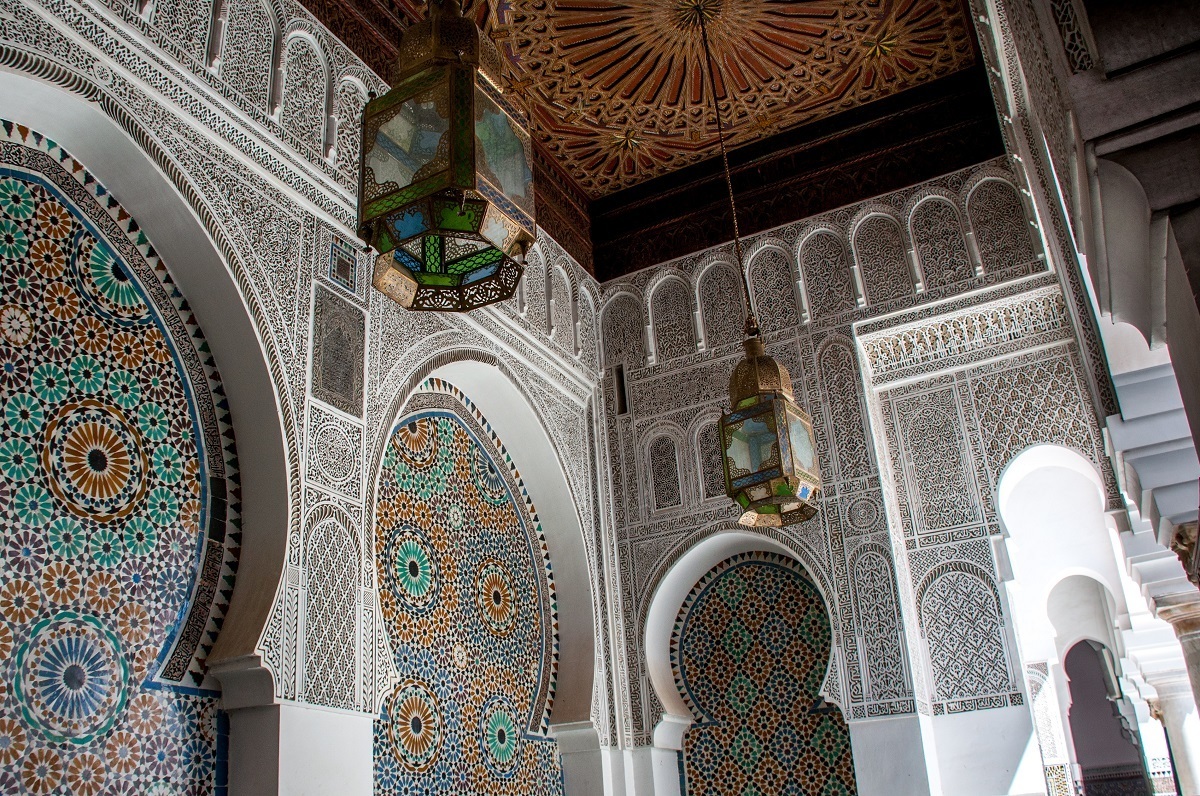 Elaborately tiled courtyard with chandeliers