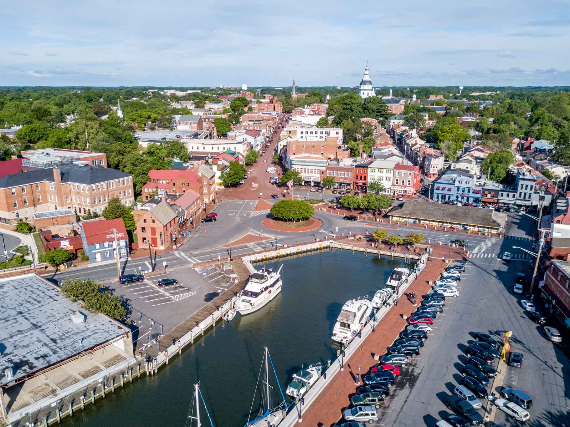 Overhead view of buildings, waterfront, and boats.