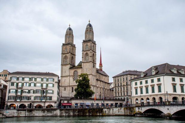 Buildings and a church beside a river