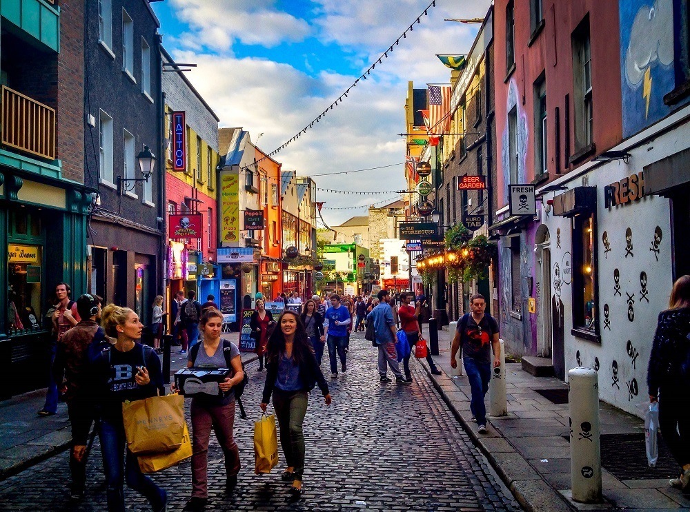 People walking near Temple Bar at dusk