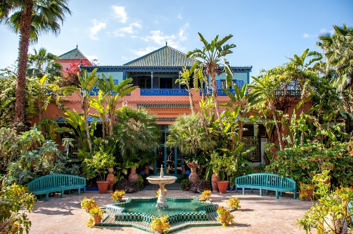 Pink and blue building with plants