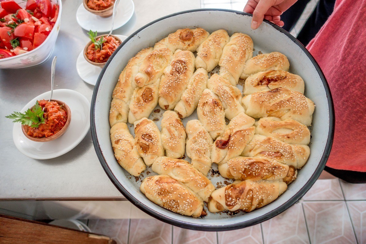 Learning the techniques of traditional cuisine at a Macedonian cooking class at Risto's Guest House in Lake Ohrid.