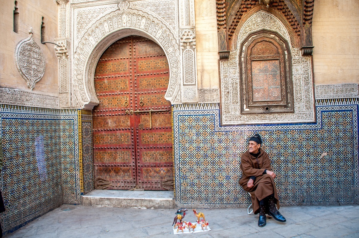 Man selling toy camels