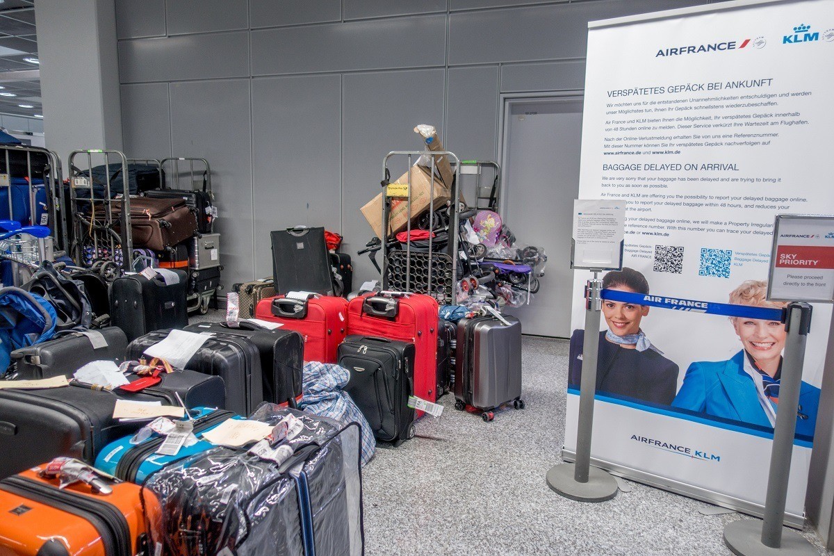 Piles of suitcases in the airline lost luggage area at the airport