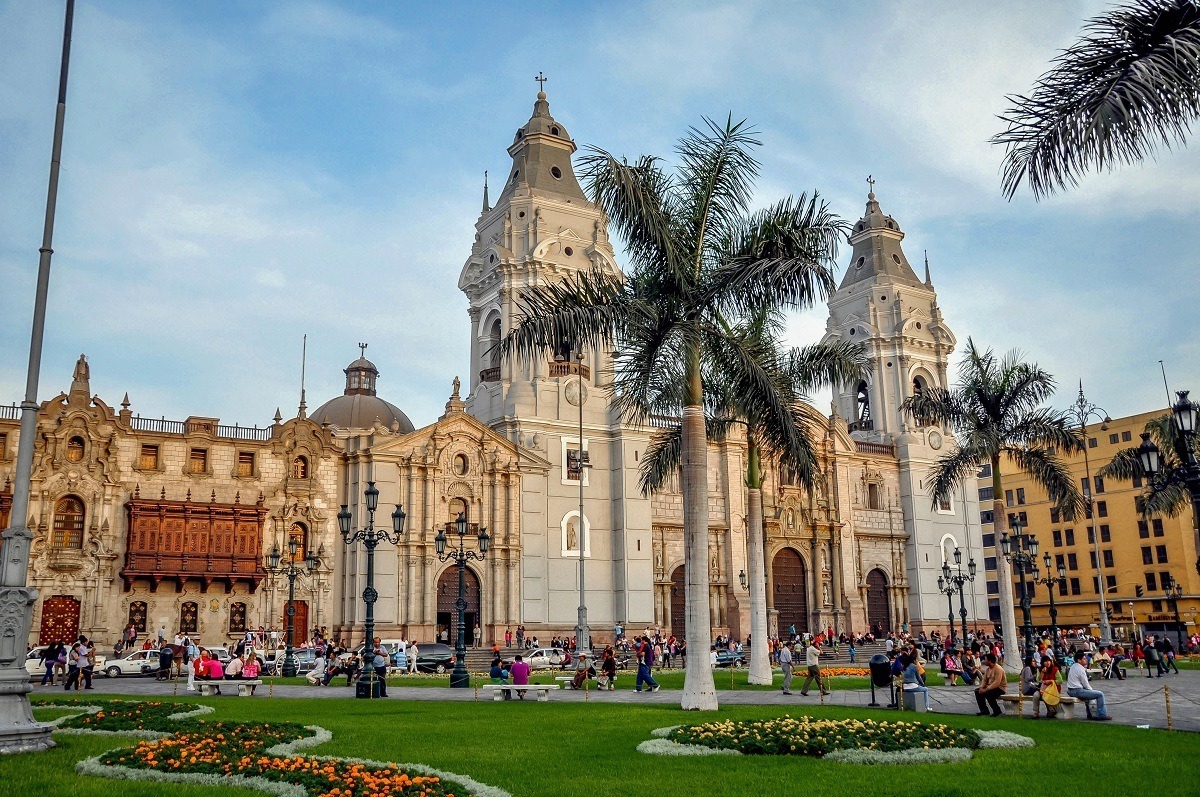 Cathedral and palm trees on a city square 