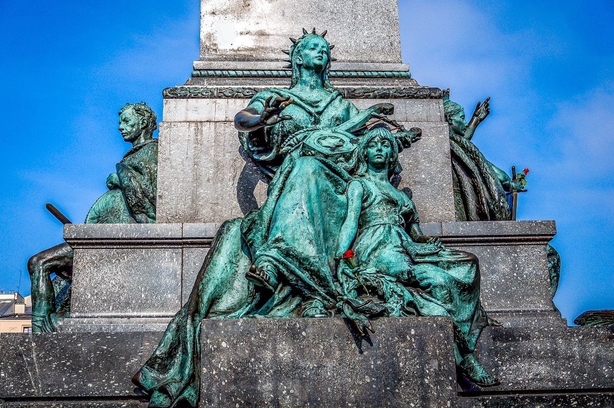 Statue of the muse at the Adam Mickiewicz Monument in Krakow's Main Market Square.