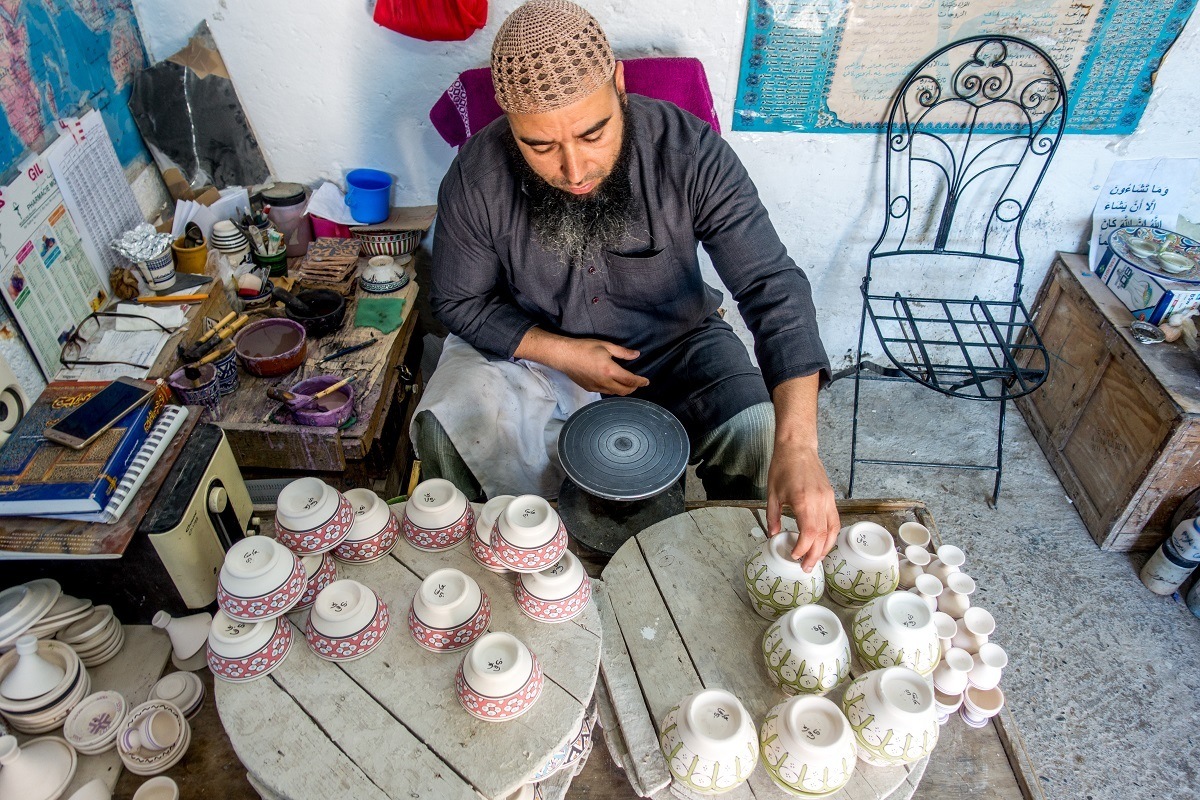 Man painting pottery