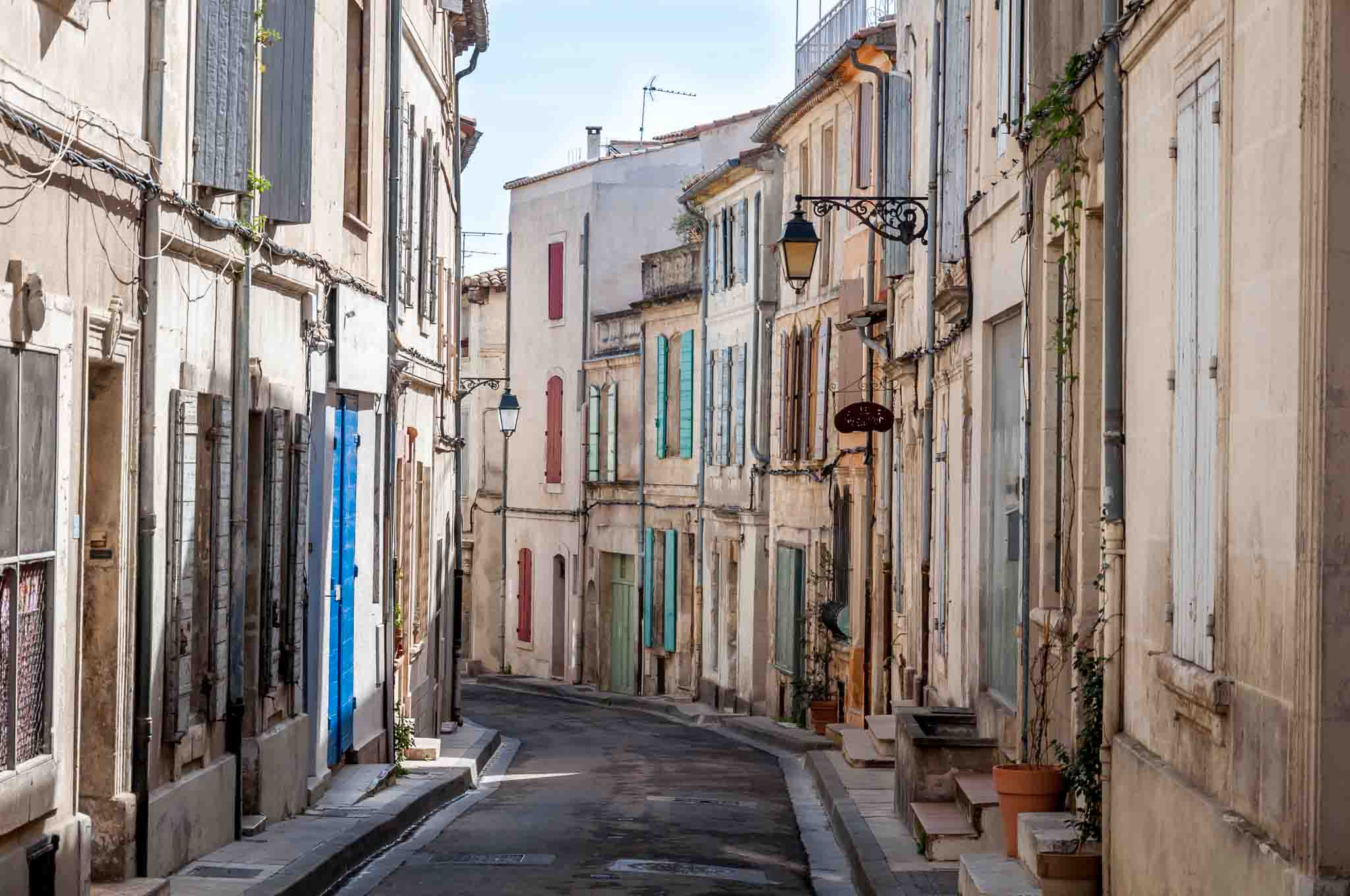 Street full of homes with colorful shutters 