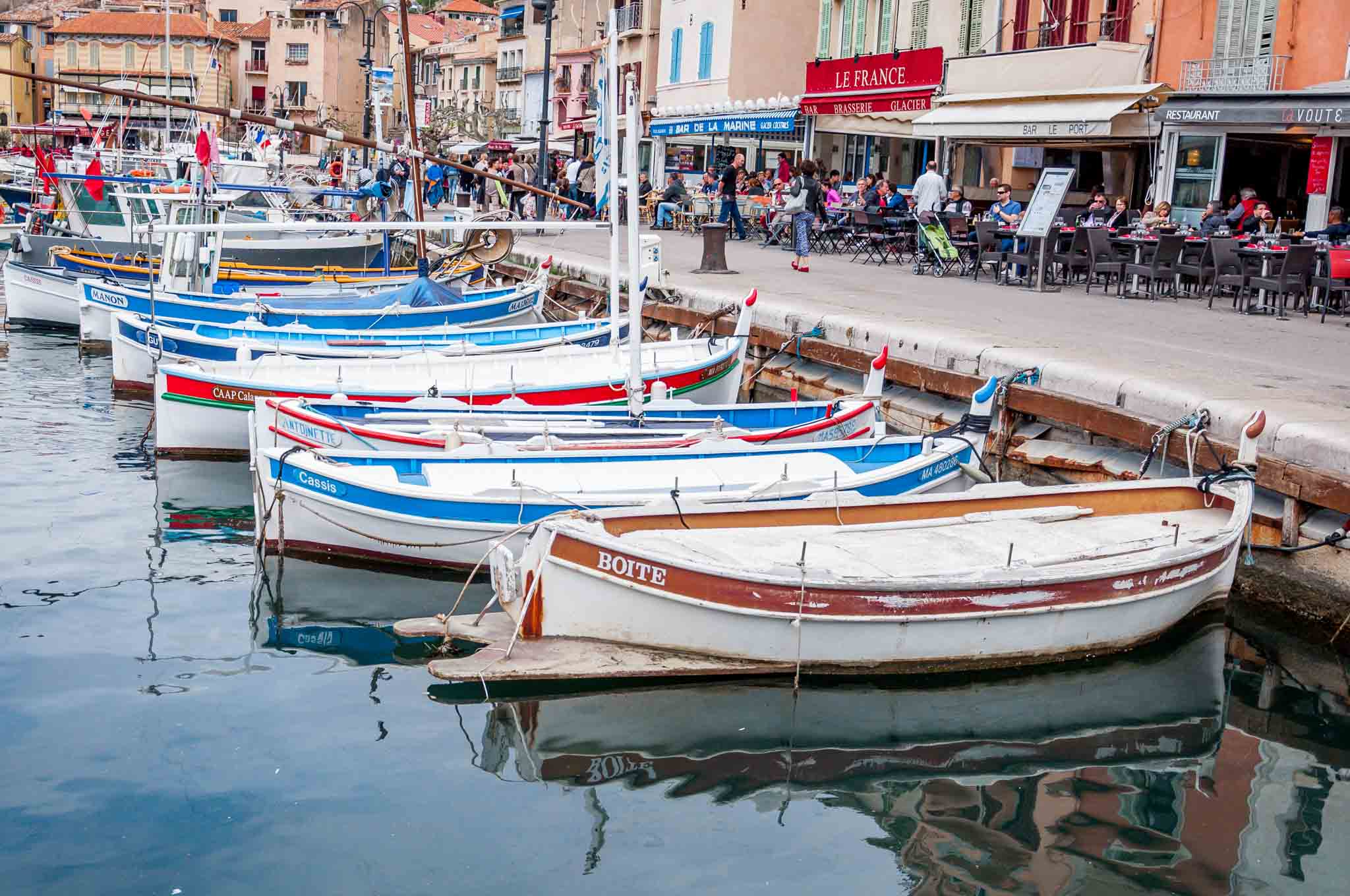 Boats docked beside a seaside restaurant