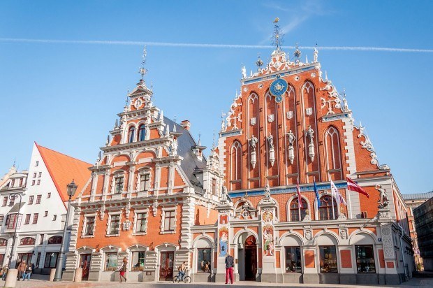 Two red buildings with ornate decorations