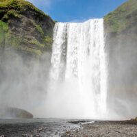 Mists coming off Skogafoss waterfall, a landmark in Iceland