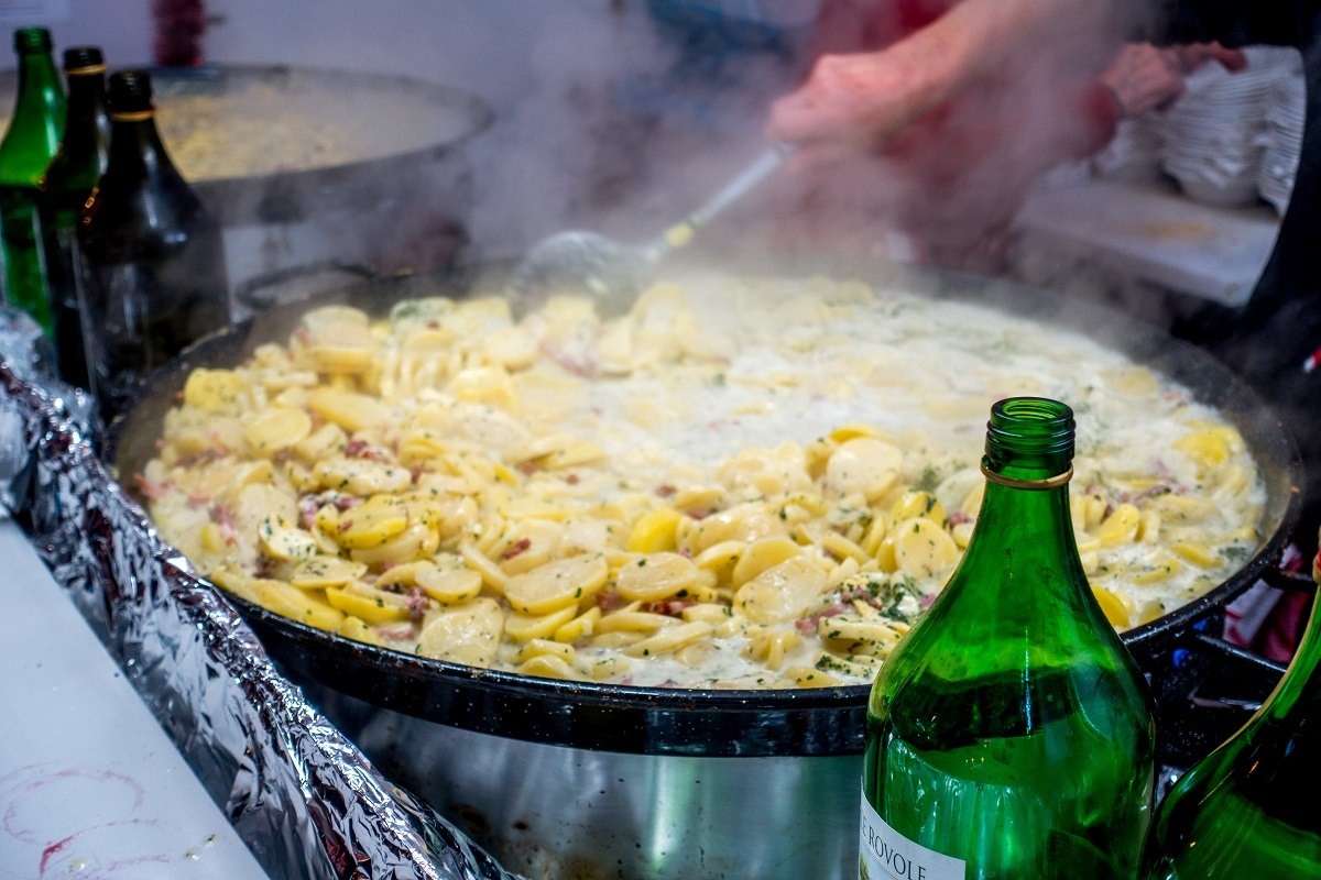 Potato dish for sale at market food stall.