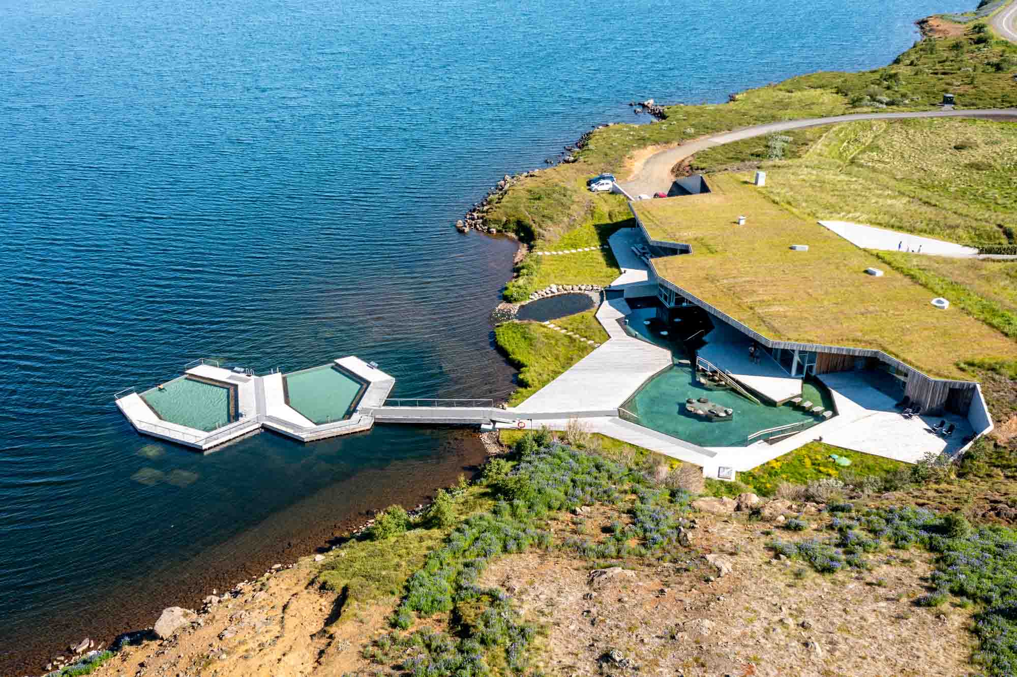 Overhead view of three pools, including 2 floating in a river