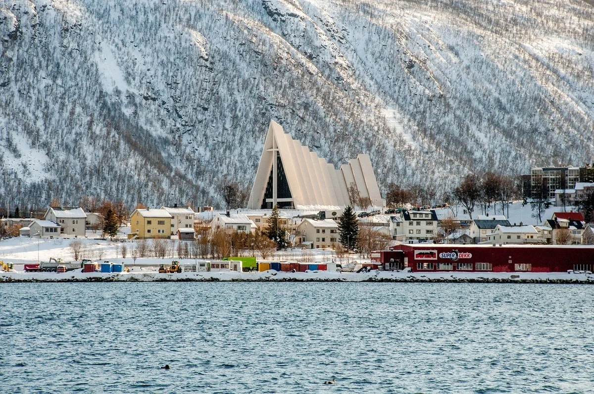 White, triangle-shaped church near the ocean