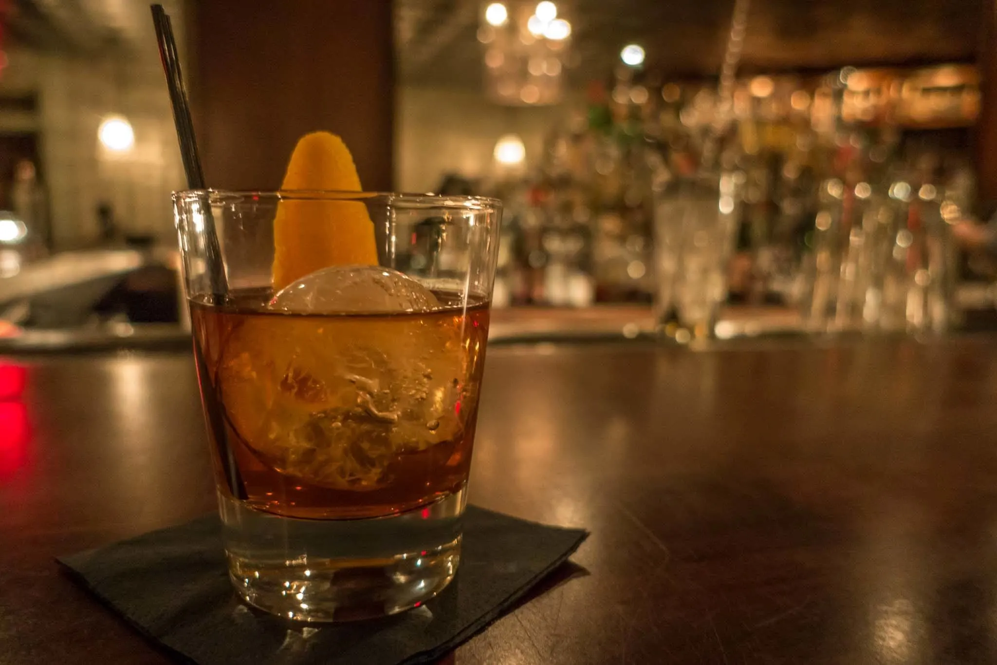 Whiskey cocktail on a bar.