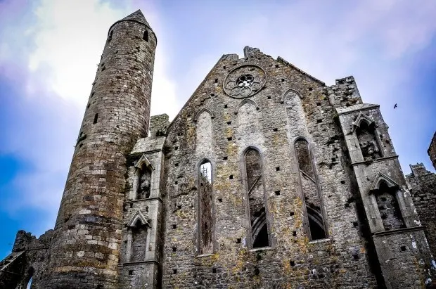 Exterior of ruins of an ancient chapel with a bell tower