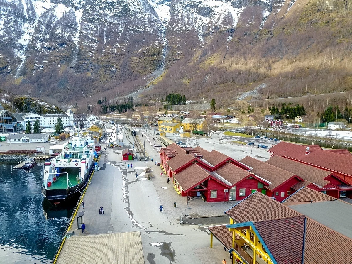 Overhead view of buildings and a boat in a harbor