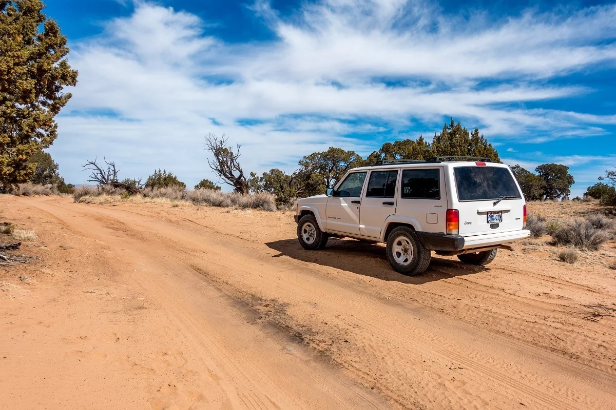 Jeep 4x4 on sandy road