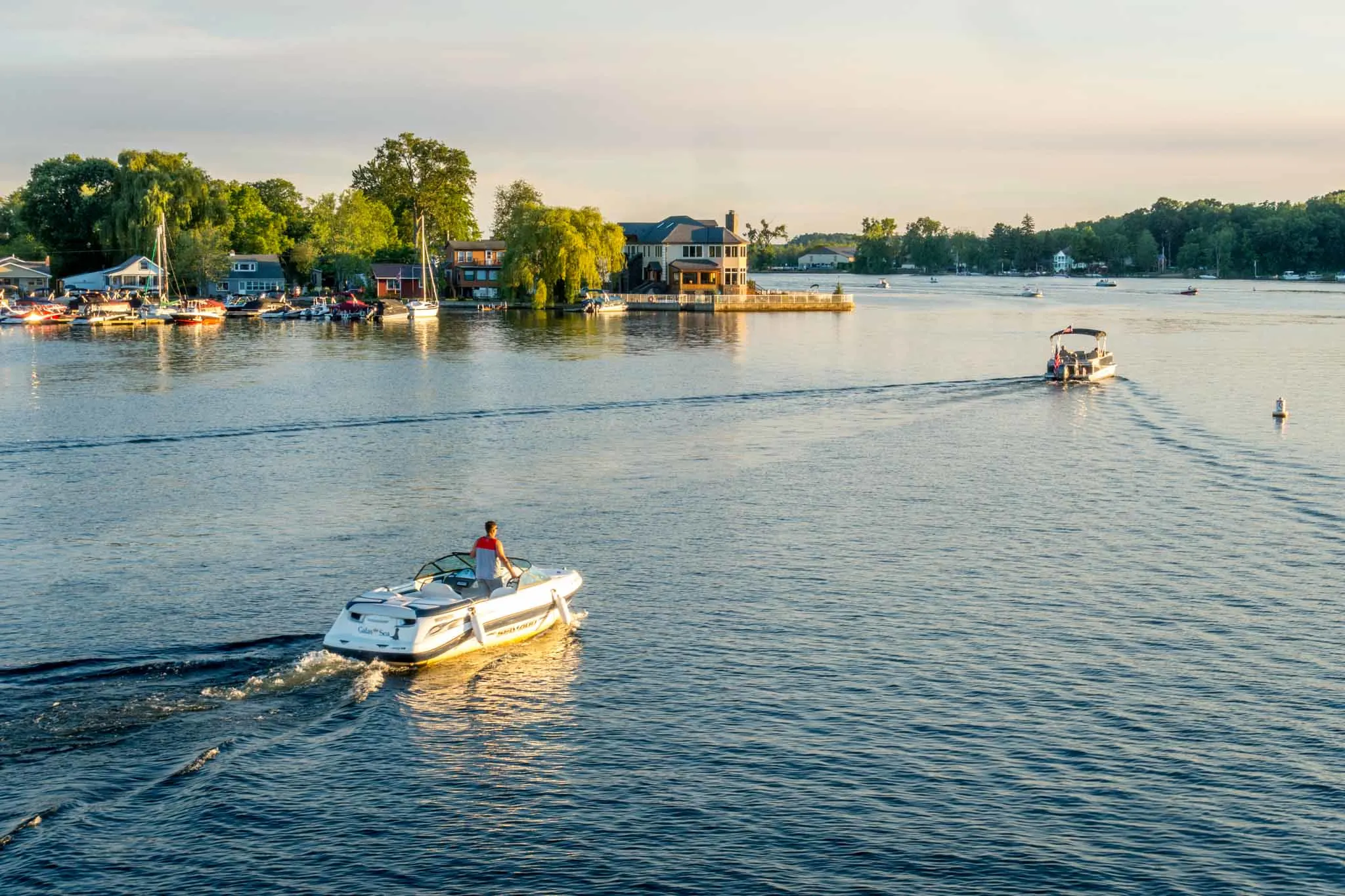 Boats on a lake at sunset